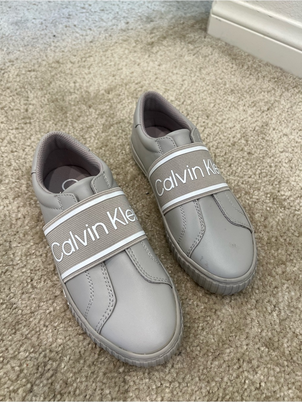 Calvin Klein women’s Elastic-Strap Sneakers in Light Gray